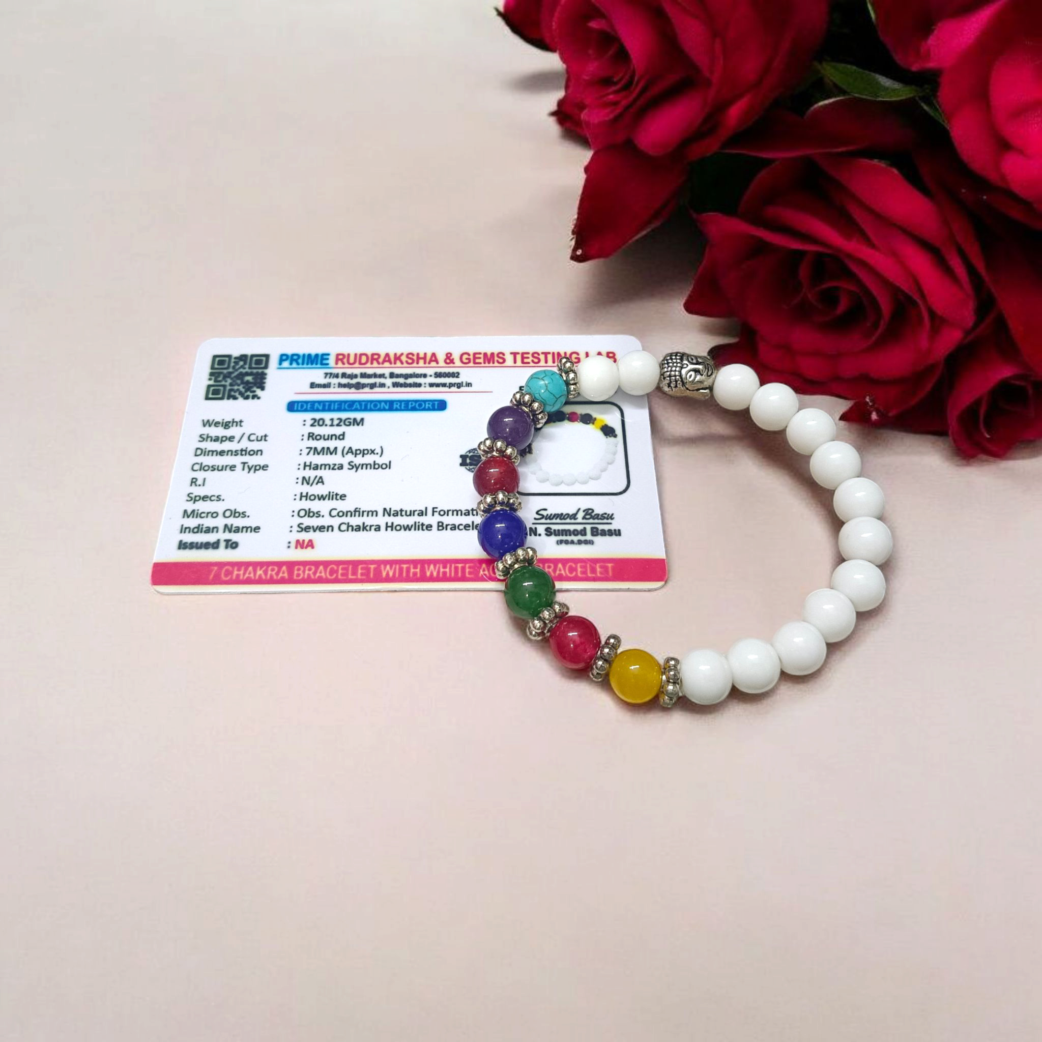 7 Chakra Bracelet featuring colorful healing stones and white Howlite beads, stretchable and lab-certified for spiritual balance