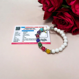 7 Chakra Bracelet featuring colorful healing stones and white Howlite beads, stretchable and lab-certified for spiritual balance