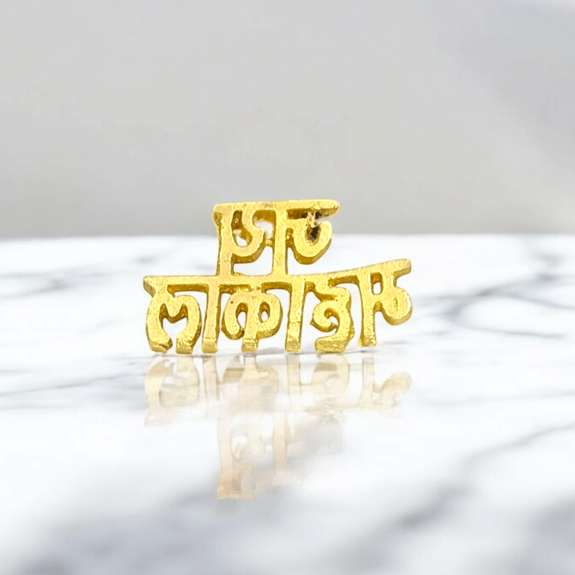 A Jai Mahakal Tilak Stamp, symbolizing the divine energy of Lord Mahakal, ready to be applied to the forehead.