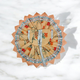 A beautifully designed Laddu Gopal dress featuring a stylish border, made of soft cotton fabric. The dress is vibrant, perfect for dressing up your Lord Krishna idol.