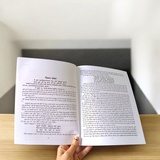 A book titled Sampurna Vastu Shastra & Dosh Nivaran in Hindi with a large font, placed on a desk with a peaceful and harmonious background symbolizing positive energy flow