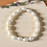 A lab-certified natural pearl bracelet featuring 10-11mm white pearls, elegantly strung together for spiritual and fashionable wear