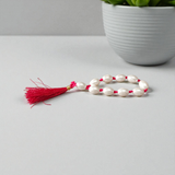 A lab-certified natural pearl finger mala with 9+1 round white pearls (10-11mm) used for chanting, meditation, and spiritual healing