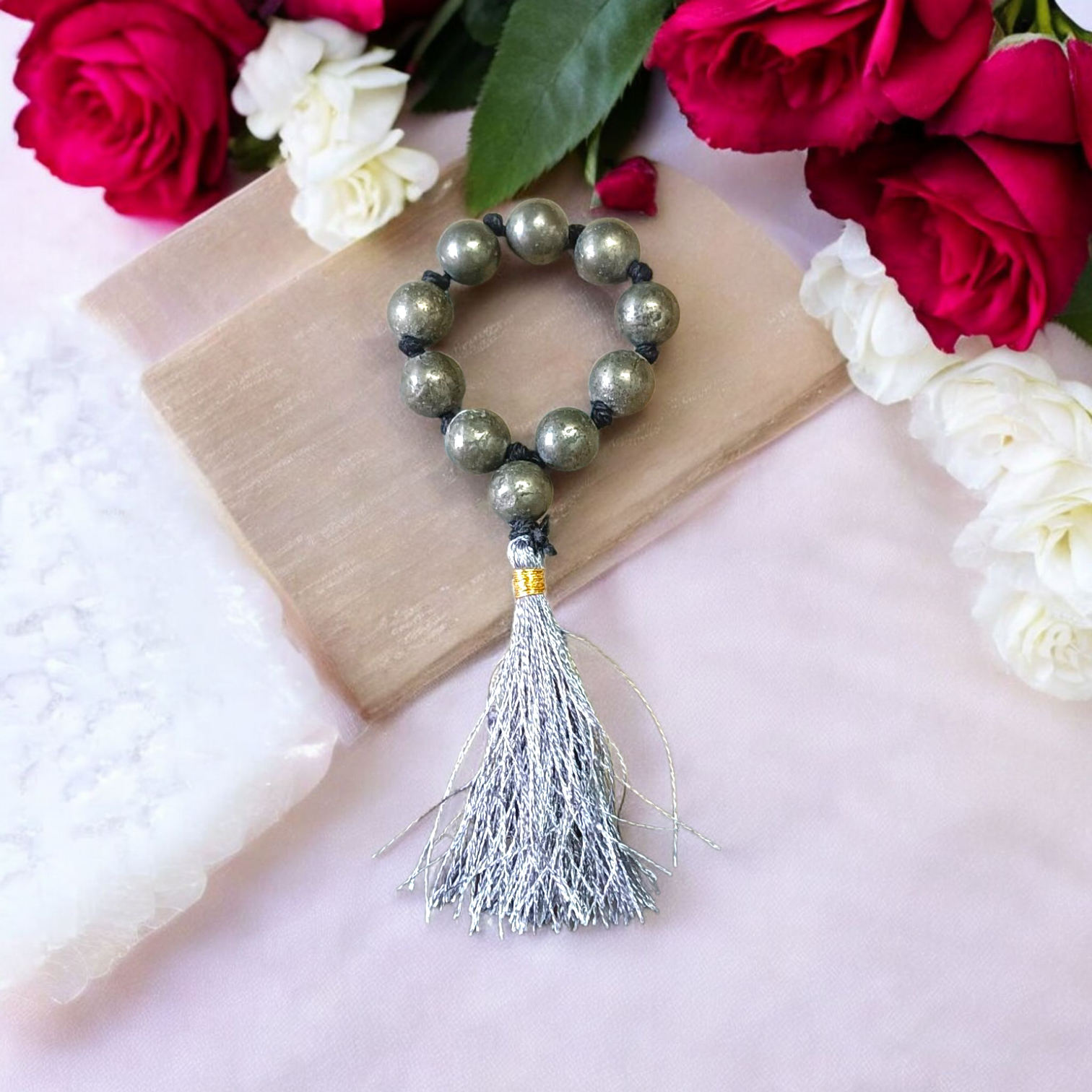A lab-certified natural pyrite finger mala featuring 9+1 polished 8mm beads, ideal for meditation, chanting, and attracting positive energy