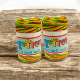 A set of vibrant colored Moli Dhaga threads tied in a bundle, ideal for religious ceremonies and spiritual protection.
