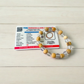 A stretchable 8mm beaded bracelet made from natural Tulsi and Sphatik crystals, ideal for spiritual and healing use, placed against a white background