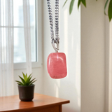 A stunning Rose Quartz Tumble Stone Pendant, lab-certified for authenticity, symbolizing love, healing, and positive energy