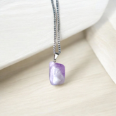 Amethyst Pendant – Natural Amethyst gemstone locket pendant on a chain, promoting emotional healing and spiritual awareness
