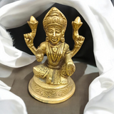 Brass statue of Goddess Lakshmi symbolizing wealth, prosperity, and abundance, finely crafted with intricate details.