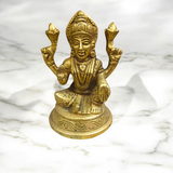 Brass statue of Goddess Lakshmi symbolizing wealth, prosperity, and abundance, finely crafted with intricate details.