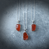 Carnelian Stone Pendant made from raw Carnelian crystal on a chain, designed to boost energy, creativity, and emotional balance.