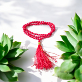 Close-up image of a lab-certified Red Coral Mala with 4MM beads and 108+1 bead count, perfect for chanting and meditation