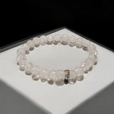 Crystal Sphatik Bracelet with natural transparent 7MM beads, lab certified, stretchable design, promoting peace, clarity, and positive energy.