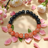 Description of the image: A beautiful Hessonite and Black Agate Bracelet featuring 8MM beads in a stretchable design with natural stones for spiritual healing