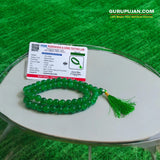 Green Agate Mala with 108 beads displayed on a spiritual setup, showcasing natural green hues and smooth polished finish