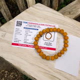 Haldi Bracelet made of 8MM natural turmeric beads, stretchable design, and certificate of authenticity for spiritual and healing benefits.