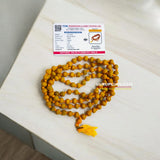 Haldi Mala crafted from natural turmeric beads, lab-certified, available for Jaap and wearing, offering health and purification benefits.