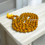 Haldi Mala crafted from natural turmeric beads, lab-certified, available for Jaap and wearing, offering health and purification benefits.