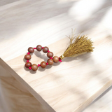 Natural Sandalwood Finger Mala featuring 9+1 smooth 8mm Chandan beads, lab-certified mala used for meditation, prayer, and spiritual energy