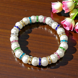 Image of Original Pearl Bracelet with 8MM natural pearls on a stretchable thread, lab-certified and suitable for astrological benefits