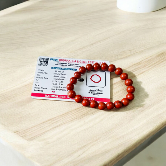 Image of a Natural Red Jasper Bracelet with 8mm polished beads, stretchable cord, and lab-certified gemstone design