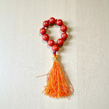 Image of a Natural Red Jasper Finger Mala with 8mm polished beads and a compact, portable design