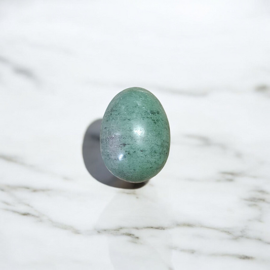 Image of handcrafted greenish black Shivling stone ideal for Tulsi plant, temple, or garden use