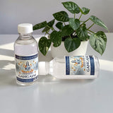 Image of two sealed 100g bottles of Pure Gangajal Holy Water, ideal for puja and spiritual rituals