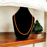 Image showing an energized Orange Monga Mala with 108+1 coral beads, ideal for Mars-related spiritual remedies