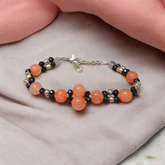 Natural Hessonite (Gomed) bracelet with 8mm round beads, stretchable and lab certified—used for mental clarity, Rahu balance, and spiritual healing