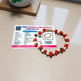 Natural Red and White Gunja bracelet with 5mm lab certified beads on stretchable cord, displayed on a neutral background