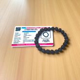 Natural black Rudraksha bracelet made with 8mm lab-certified beads, stretchable design displayed on a clean white surface