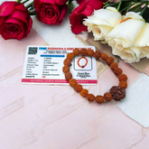 Original 5 Face Rudraksha Bracelet made with AAA Grade handpicked beads, stretchable and lab certified, placed on a rustic wooden surface