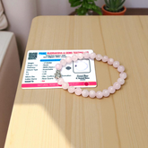 Rose Quartz Bracelet with 8mm natural pink beads, stretchable, lab certified, displayed on a neutral background