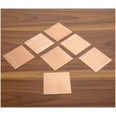 Set of 11 Copper Square Pieces (Copper Patra) used for Vastu correction, spiritual rituals, and energy enhancement.
