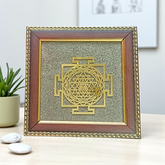 Shree Yantra mounted on raw Pyrite crystal in a wooden Vastu-compliant photo frame for spiritual home and office décor