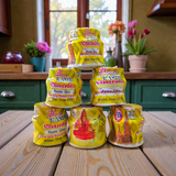 Yellow chandan paste tika container used for puja and tilak rituals