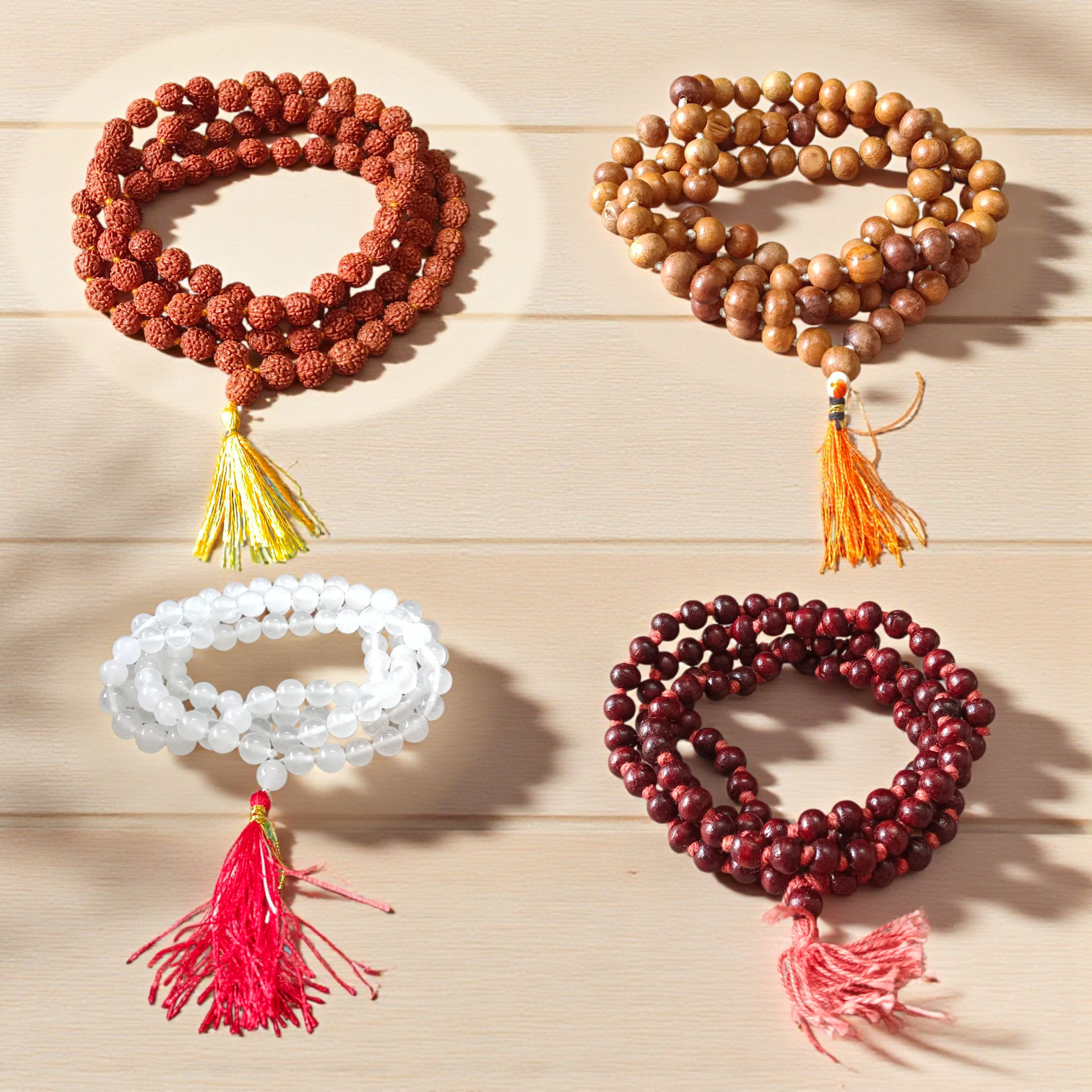 mage showing a Combo of 4 Jaap Malas (Rudraksha, Sphatik, Red & White Chandan) placed neatly with 108+1 beads in each, ideal for meditation and chanting