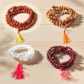 mage showing a Combo of 4 Jaap Malas (Rudraksha, Sphatik, Red & White Chandan) placed neatly with 108+1 beads in each, ideal for meditation and chanting