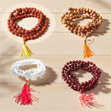 mage showing a Combo of 4 Jaap Malas (Rudraksha, Sphatik, Red & White Chandan) placed neatly with 108+1 beads in each, ideal for meditation and chanting
