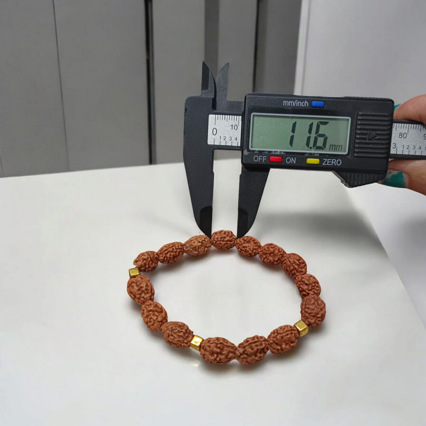 3 Mukhi Rudraksha Bracelet with natural brown beads on stretchable thread, lab certified for spiritual healing and confidence