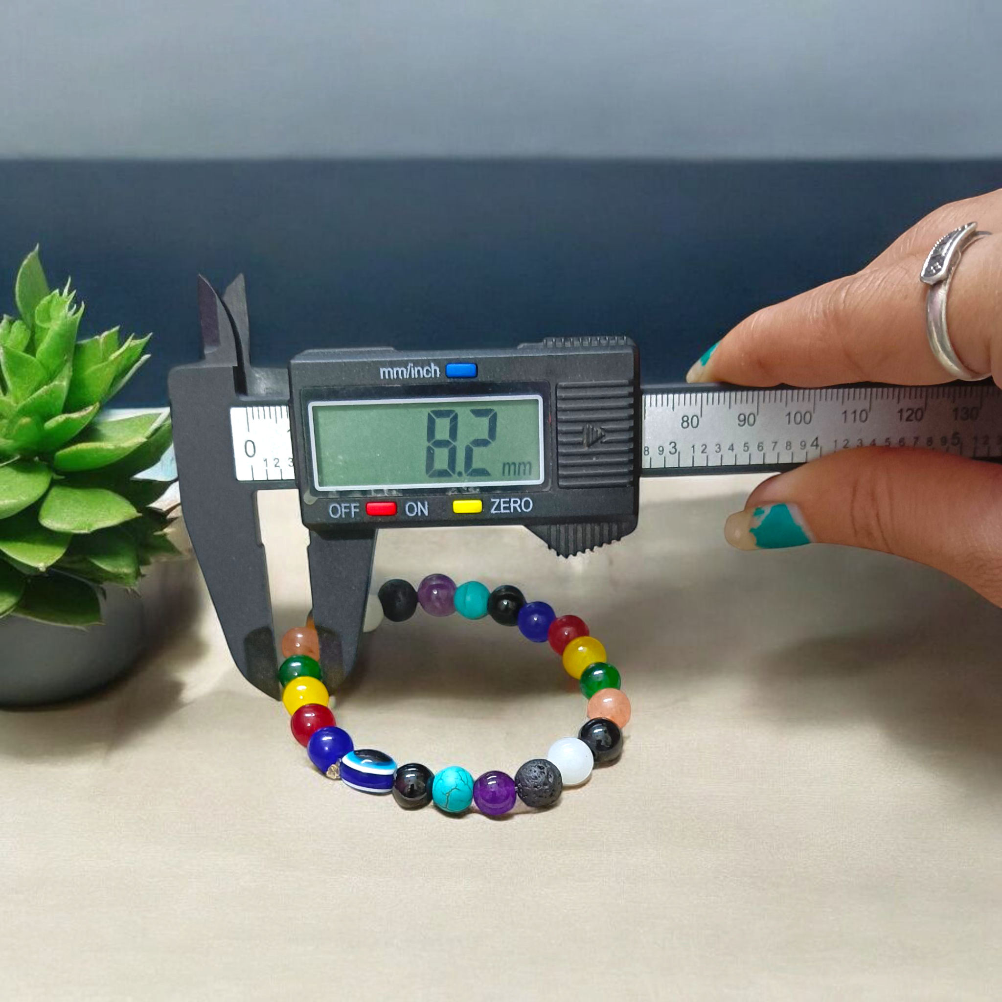 7 Chakra Healing Bracelet with Mix Agate & Evil Eye Beads on White Background