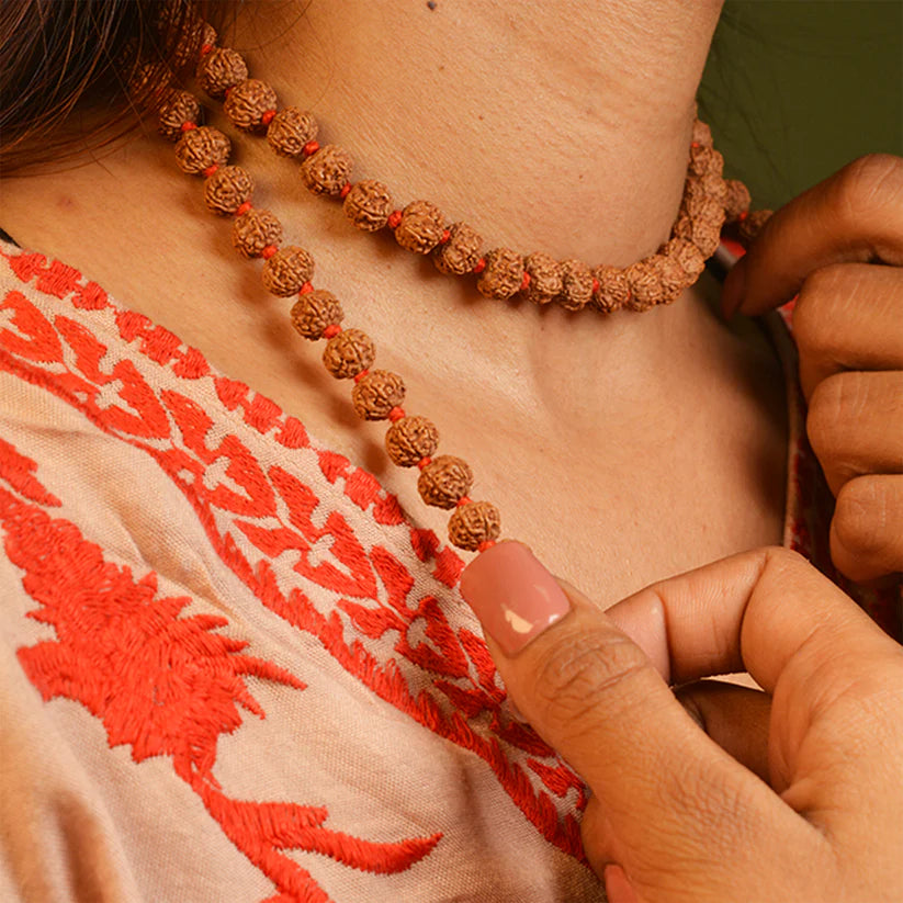 7 Mukhi Rudraksha Mala blessed by Mahalakshmi, lab-certified for wealth attraction, available in 27+1, 54+1, and 108+1 bead variants by Gurupujan.