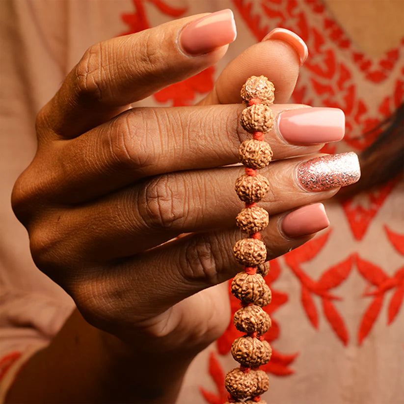 7 Mukhi Rudraksha Mala blessed by Mahalakshmi, lab-certified for wealth attraction, available in 27+1, 54+1, and 108+1 bead variants by Gurupujan.