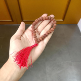 7 Mukhi Rudraksha Mala blessed by Mahalakshmi, lab-certified for wealth attraction, available in 27+1, 54+1, and 108+1 bead variants by Gurupujan