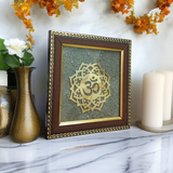 7x7 Inch Om Shanti Yantra mounted on raw Pyrite crystal in a Vastu-aligned wooden frame for peaceful home and spiritual décor