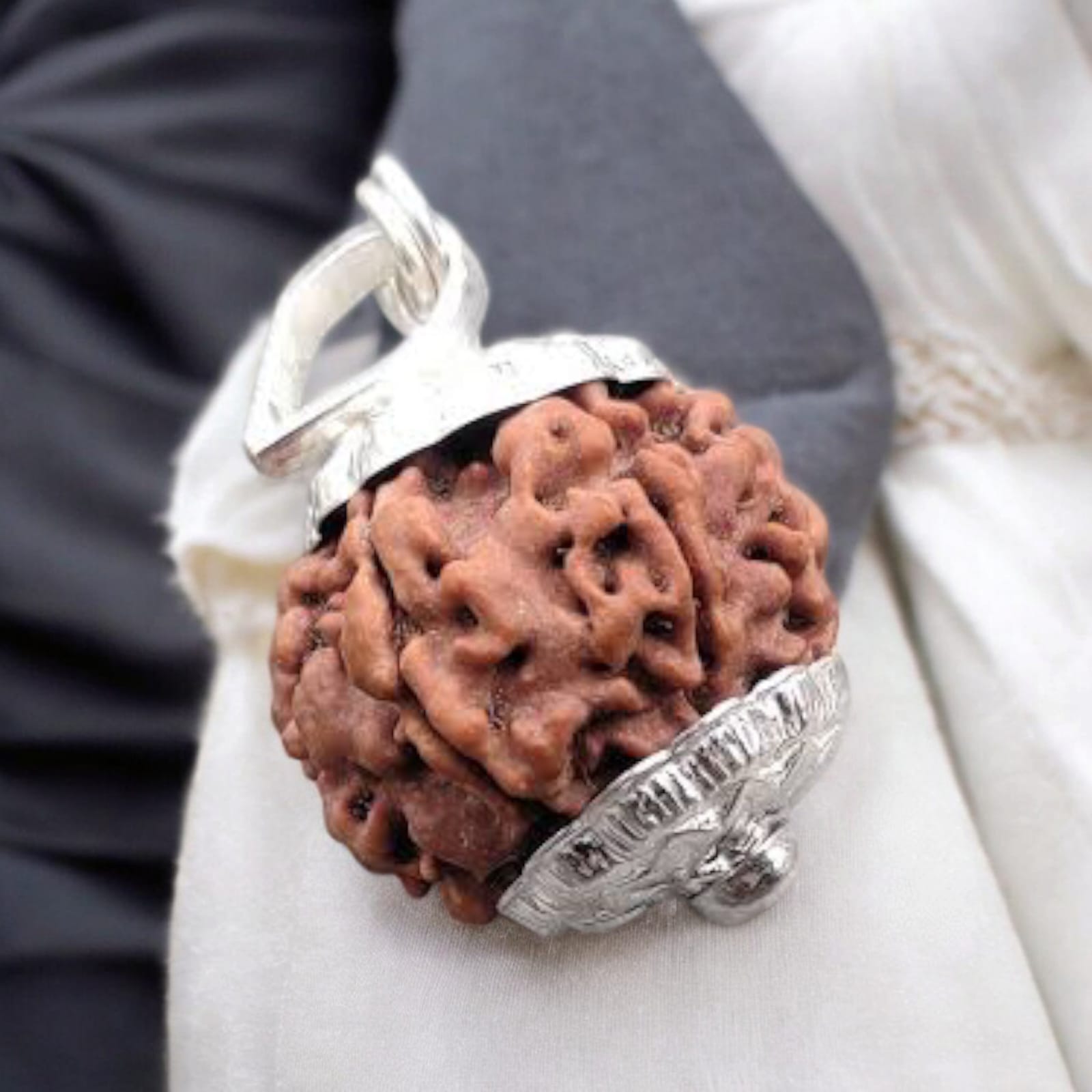 9 Mukhi Rudraksha bead, representing Goddess Durga's blessings for empowerment, protection, and spiritual growth