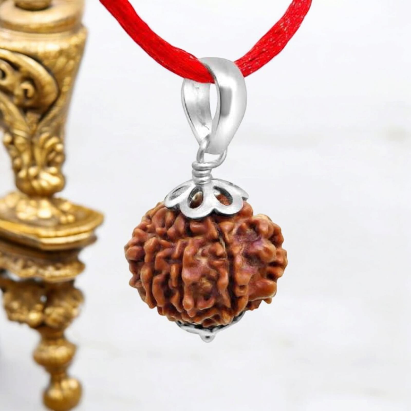 9 Mukhi Rudraksha bead, representing Goddess Durga's blessings for empowerment, protection, and spiritual growth