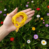 A 108+1 bead Natural Yellow Agate Mala made of polished 6mm yellow hakik stones, perfect for chanting and wearing