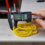 A 108+1 bead Natural Yellow Agate Mala made of polished 6mm yellow hakik stones, perfect for chanting and wearing